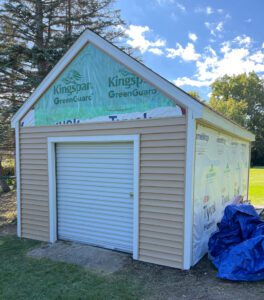 shed transformation in franklin wi featuring new siding and roof repair